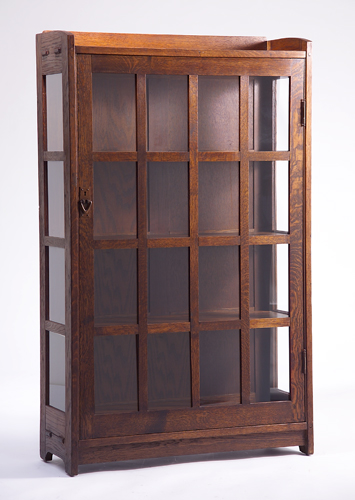 Appraisal: GUSTAV STICKLEY Single-door china cabinet with gallery top sixteen panes