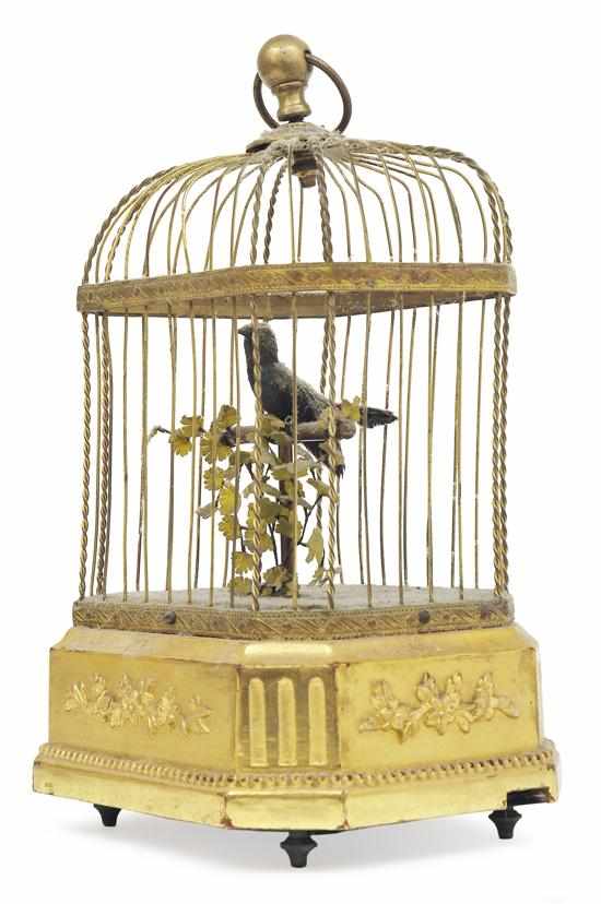 Appraisal: A SMALL RECTANGULAR GILT METAL CAGED SINGING BIRD AUTOMATON Presented