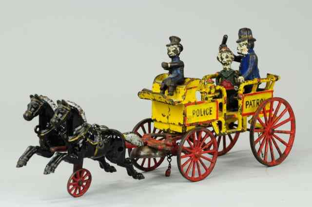 Appraisal: HAPPY HOOLIGAN POLICE PATROL WAGON Kenton cast iron amusing example