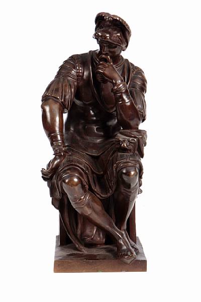 Appraisal: A patinated bronze figure of a seated gentleman height in