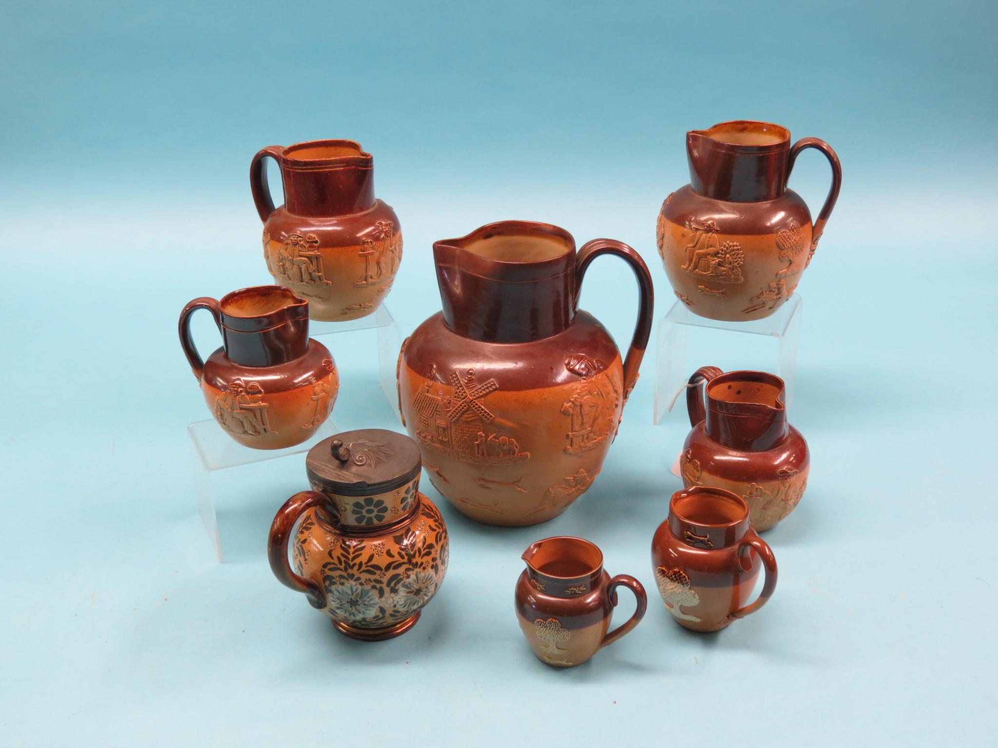 Appraisal: Seven graduated Doulton stoneware harvest jugs Victorian and later two-tone