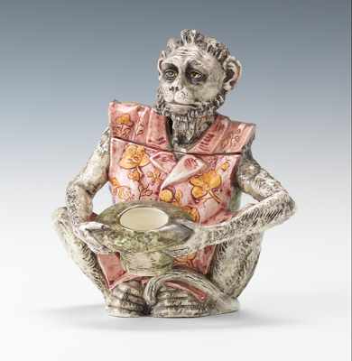 Appraisal: A Majolica Figural Monkey Beggar Humidor Majolica polychrome glazes on