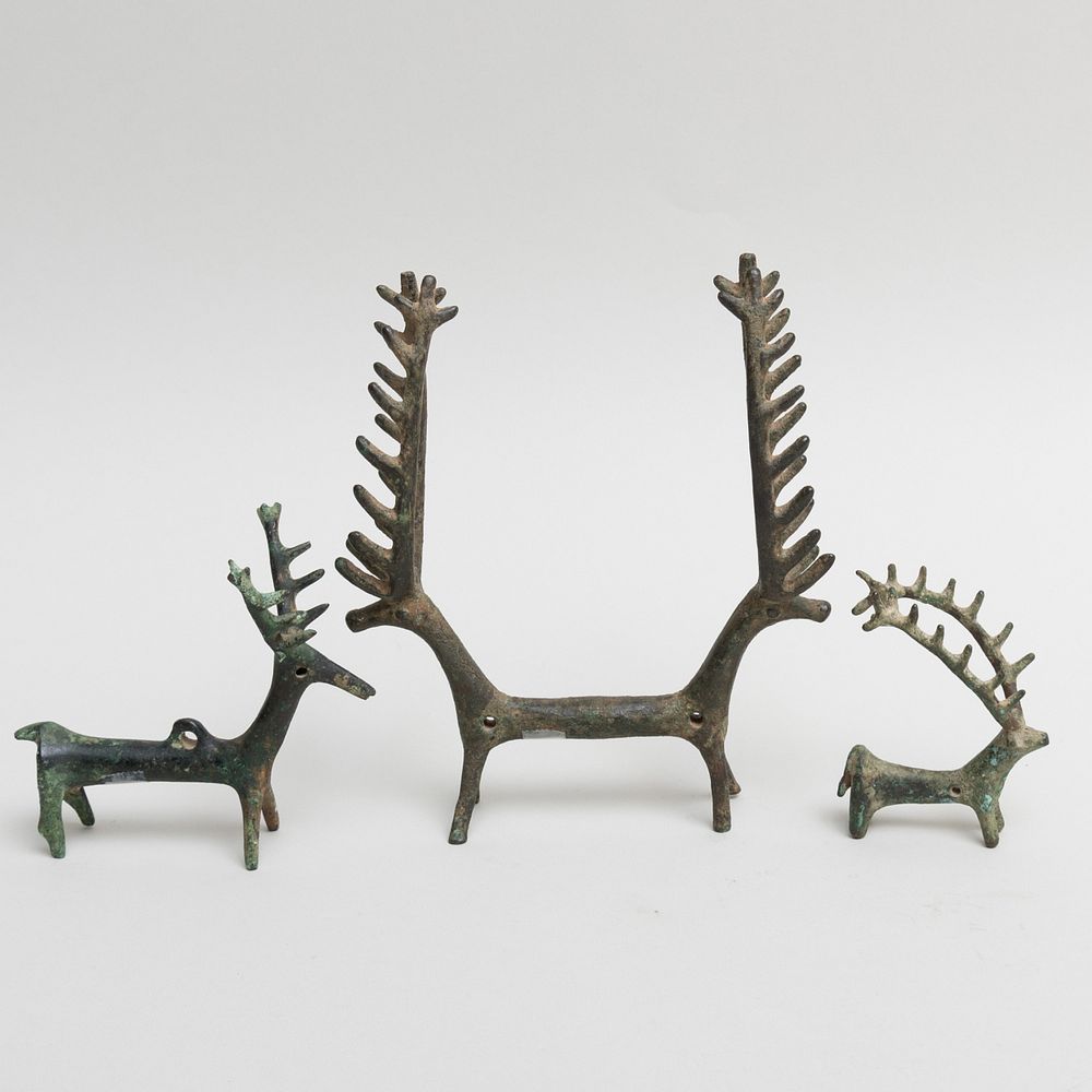 Appraisal: Group of Three Luristan Bronze Stag Amulets The double-headed possibly