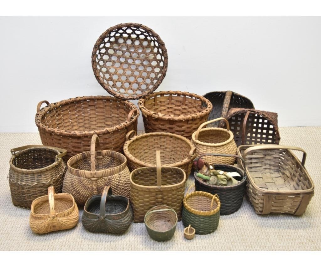 Appraisal: Collection of baskets including a large splint wood gather basket