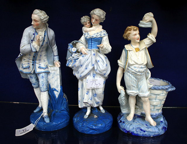 Appraisal: THREE VARIOUS BLUE DECORATED CONTINENTAL FIGURINES one of a lady