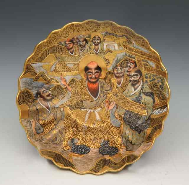 Appraisal: A JAPANESE SATSUMA EARTHENWARE DISH of circular petal form with