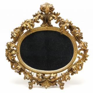 Appraisal: Rococo Style Brass Boudoir Mirror early th century with foliate