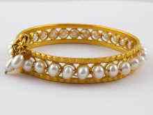 Appraisal: A yellow metal tests carat gold cultured pearl bangle