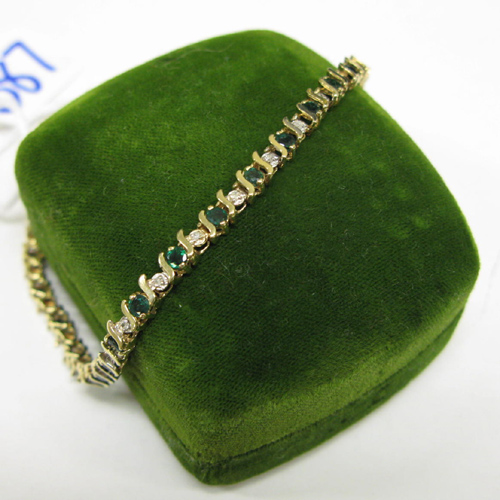 Appraisal: EMERALD DIAMOND AND FOURTEEN KARAT GOLD BRACELET set with round-cut