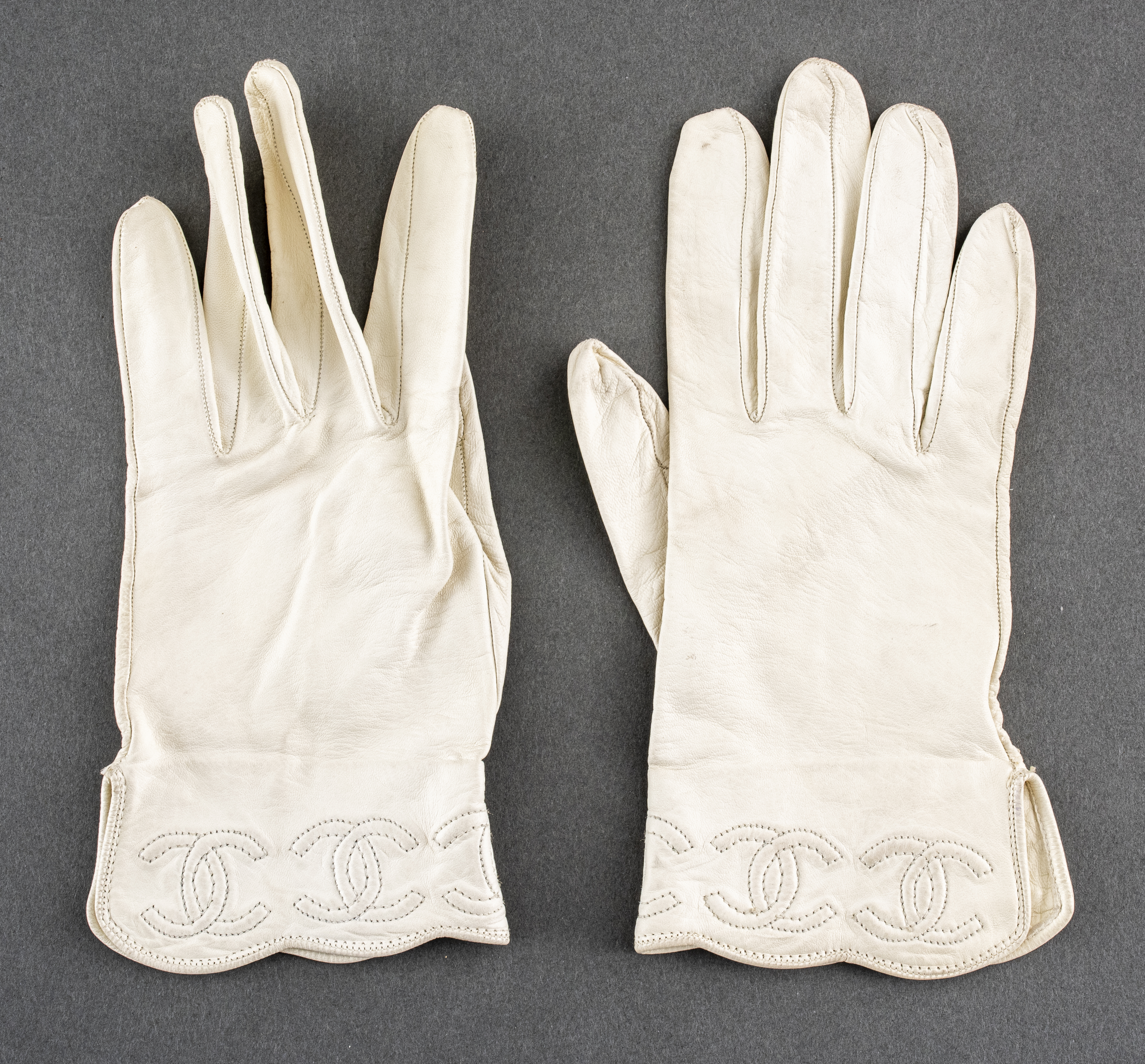 Appraisal: CHANEL WHITE LEATHER VINTAGE GLOVES Pair of Chanel white leather