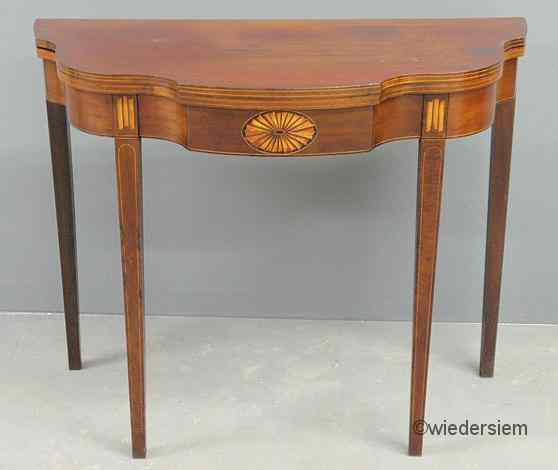 Appraisal: Federal style inlaid mahogany gaming table with a shaped top