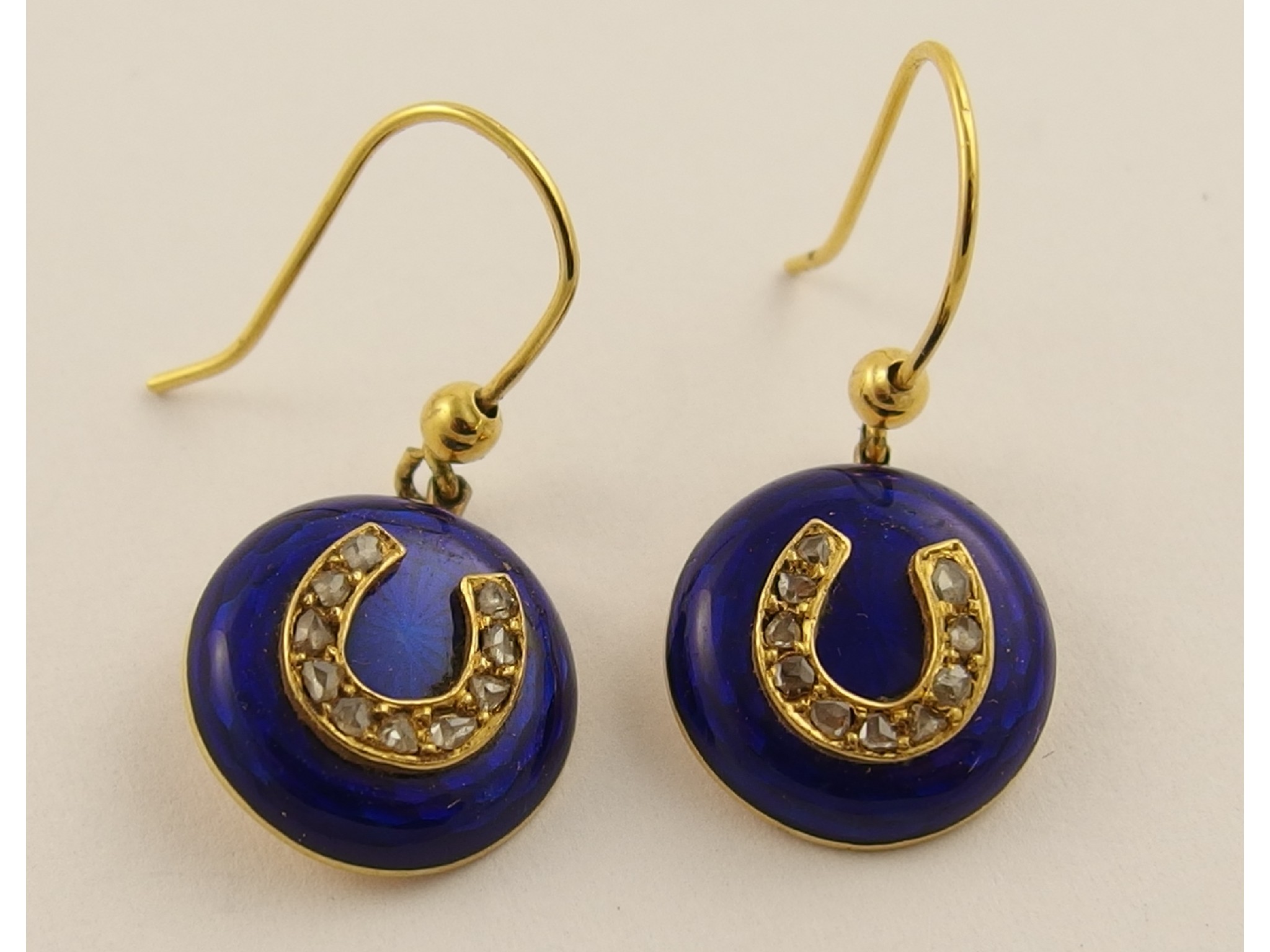 Appraisal: A pair of yellow metal horseshoe earrings set with rose