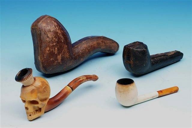 Appraisal: A CONTINENTAL CARVED PIPE IN THE FORM OF A HUMAN