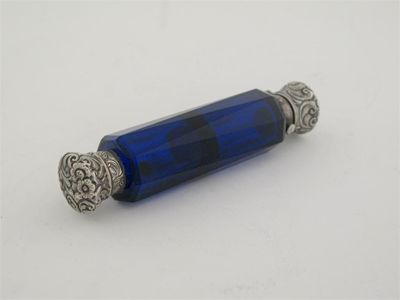 Appraisal: A late Victorian mounted faceted deep blue glass scent bottle