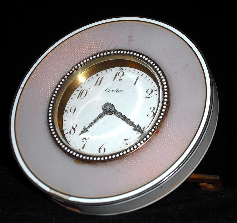 Appraisal: Small circular enamel easel timepiece the white dial signed Cartier