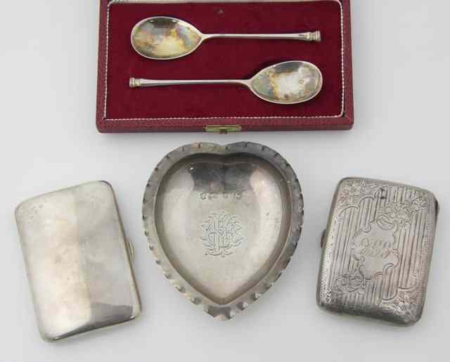 Appraisal: A heart-shaped silver pin tray Birmingham with wavy rim and