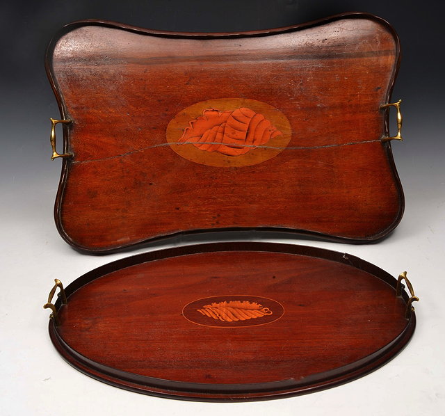 Appraisal: AN EDWARDIAN MAHOGANY OVAL TWIN HANDLED TRAY inlaid to the