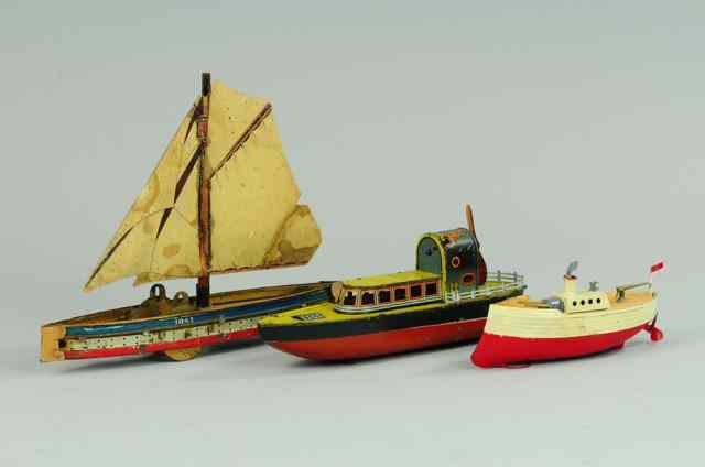 Appraisal: THREE NAUTICAL TOYS Lot includes litho tin Hess Sail boat