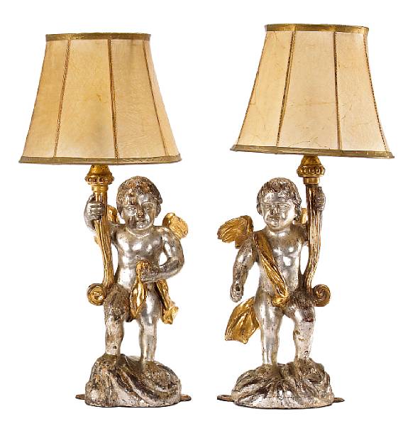 Appraisal: A pair of Italian silvered and parcel giltwood figures of