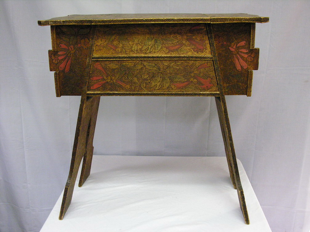 Appraisal: PYRO FOLK ART SEWING TABLE Flowering vine motif drawers two