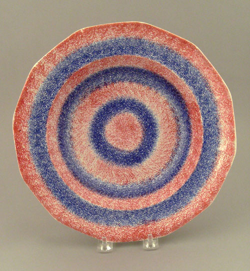 Appraisal: Red and blue rainbow spatter bullseye shallow bowl th c