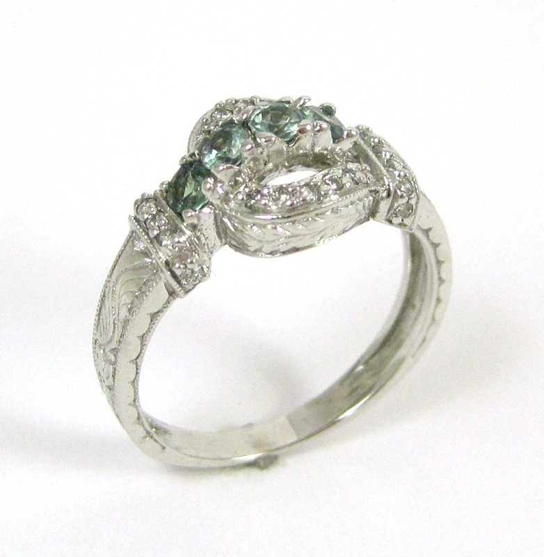 Appraisal: GREEN SAPPHIRE AND FOURTEEN KARAT WHITE GOLD RING with round-cut