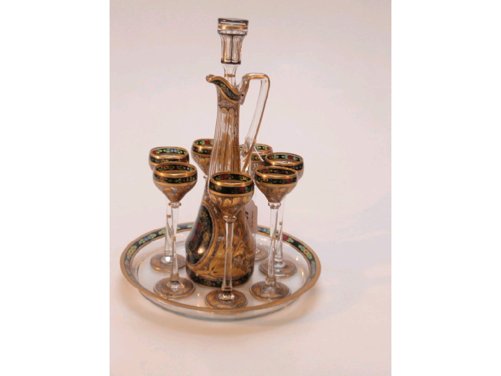 Appraisal: An Arts Crafts inspired liquor set comprising decanter with stopper