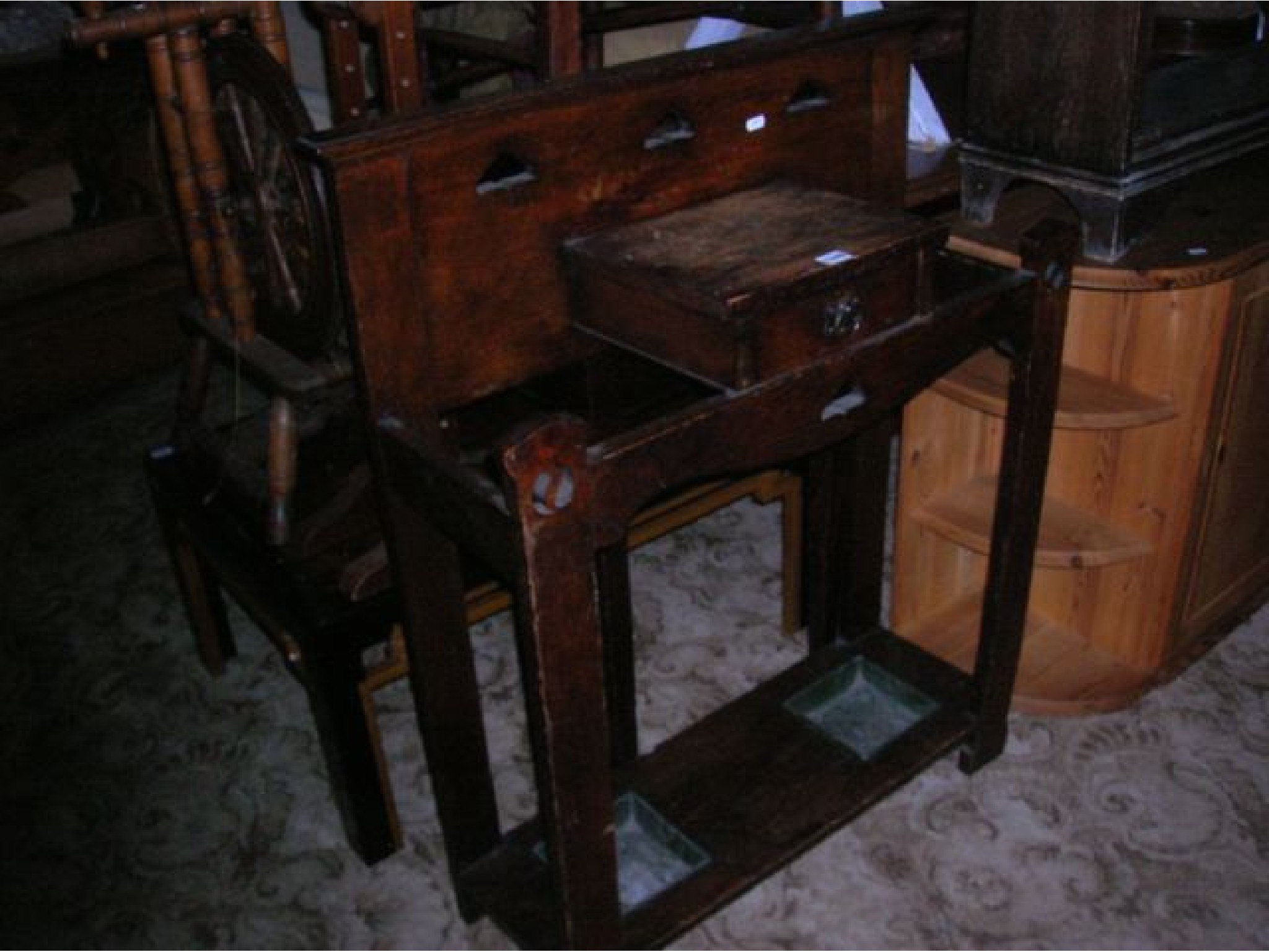 Appraisal: An Arts Crafts style oak two divisional umbrella stickstand with