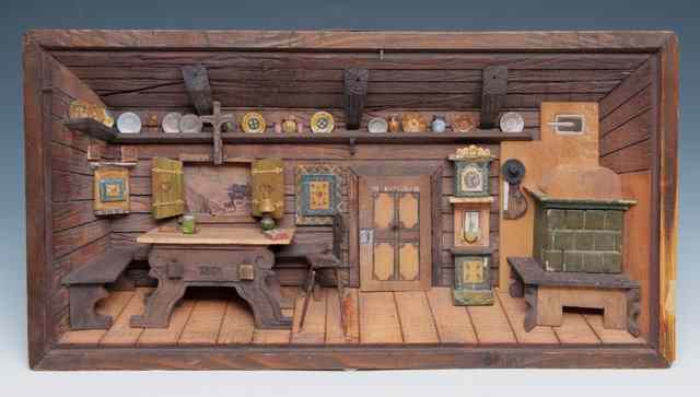 Appraisal: AN AUSTRIAN CARVED PINE DIORAMA depicting an interior wide x