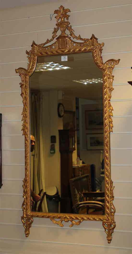 Appraisal: A Chippendale revival carved giltwood wall mirror with shaped plate