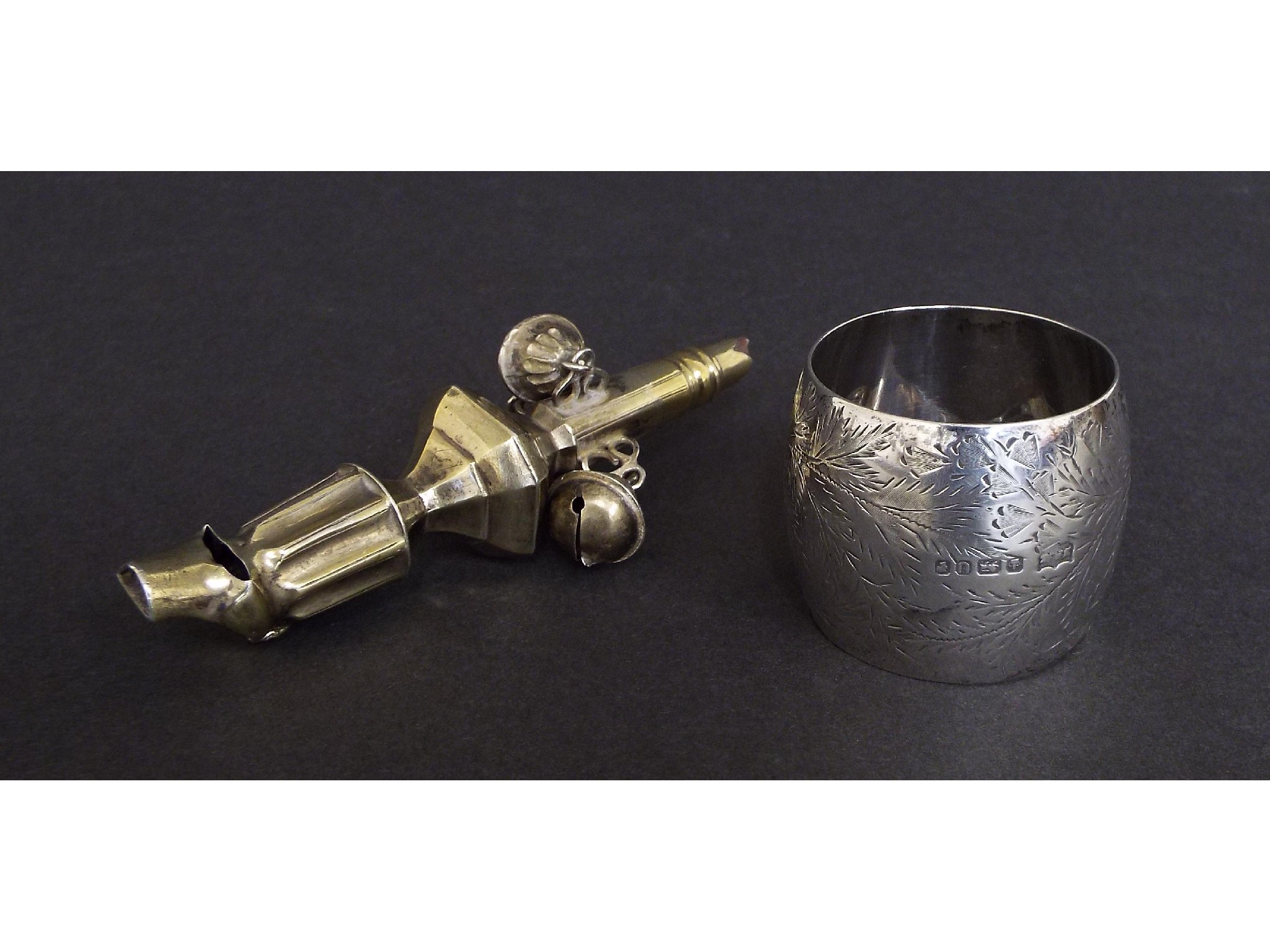 Appraisal: Continental gilded white metal baby's rattle with whistle long together