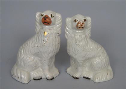 Appraisal: Assembled pair of Staffordshire Spaniels th century White with painted