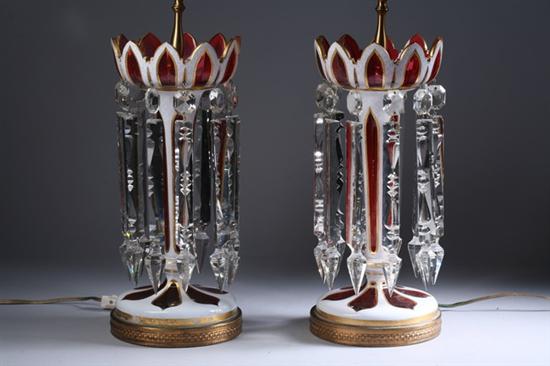 Appraisal: PAIR VICTORIAN CRANBERRY GLASS LUSTERS Suspending prisms Modelled as lamps