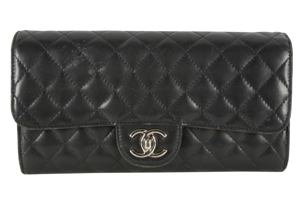 Appraisal: CHANEL QUILTED CLUTCH WITH CHAINcirca black leather with authentic card