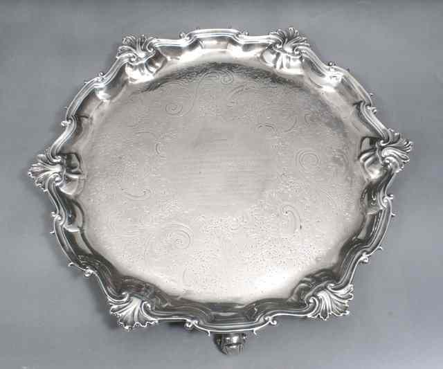 Appraisal: A GEORGE II SILVER SALVER with shell and scroll border