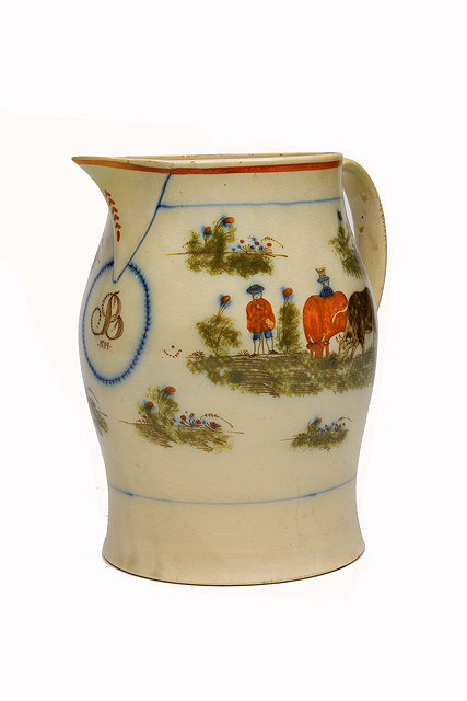 Appraisal: A GEORGE III PRATT WARE POTTERY HARVEST JUG decorated with