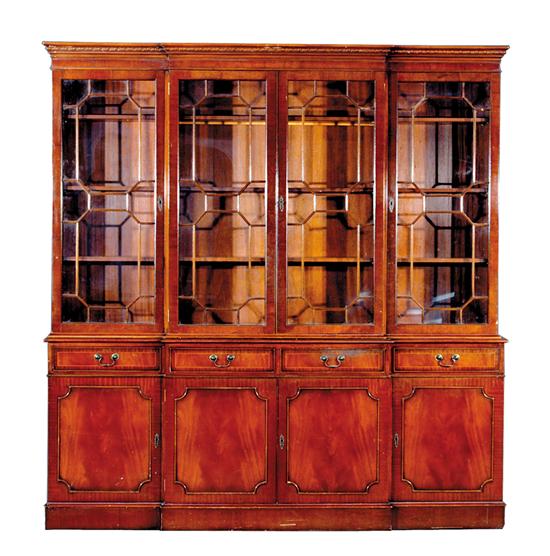 Appraisal: Georgian style mahogany breakfront molded cornice over four glazed bookcase