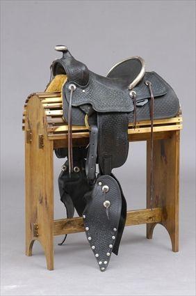 Appraisal: SILVER-MOUNTED STAMPED LEATHER PARADE SADDLE AND BRIDLE The silver stamped