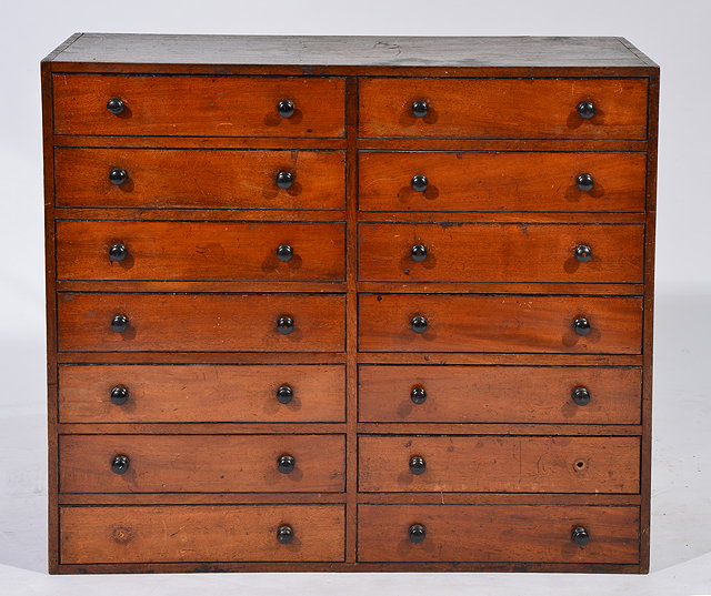 Appraisal: A TH CENTURY MAHOGANY TABLE TOP COLLECTOR'S CABINET of fourteen