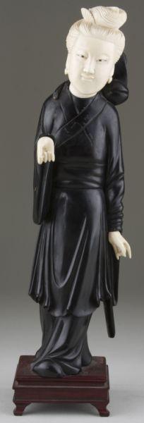 Appraisal: Asian Carved Ebony and Ivory Figural a woman in draped