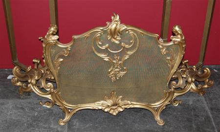 Appraisal: A Louis XV style gilt bronze fire guard and a