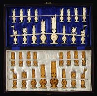 Appraisal: CARVED IVORY CHESS SET The hinged case acting as a