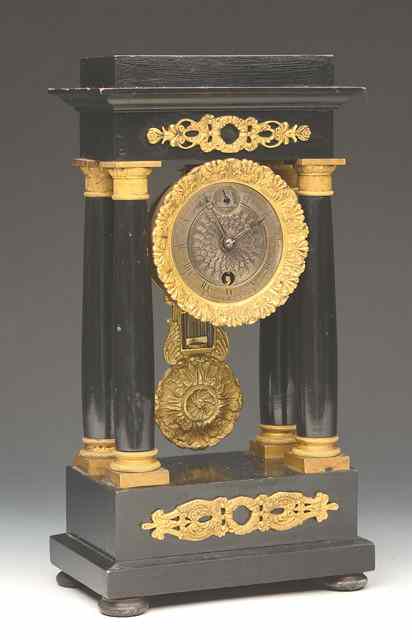 Appraisal: A TH CENTURY FRENCH EBONISED AND ORMOLU MOUNTED PORTICO TIMEPIECE