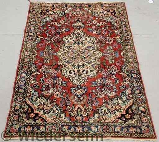 Appraisal: Persian oriental mat with a red field and floral decoration