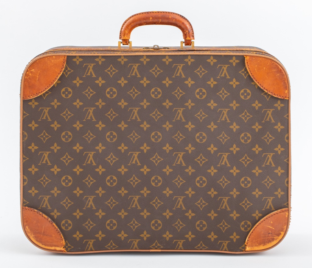 Appraisal: LOUIS VUITTON SOFT-SIDED LEATHER SUITCASE Vintage Louis Vuitton soft-side leather