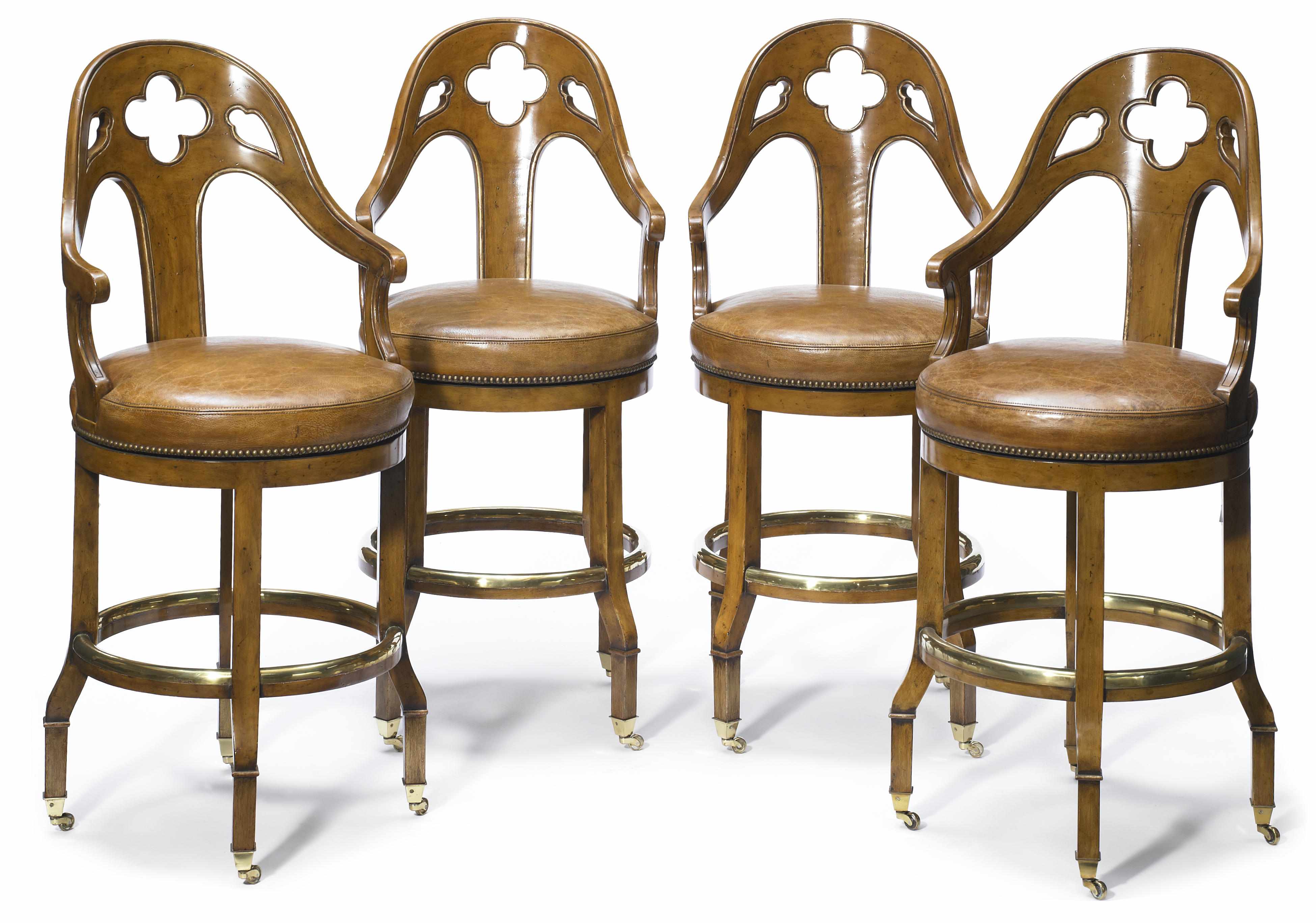 Appraisal: A set of four Gothic Revival mixed wood revolving bar