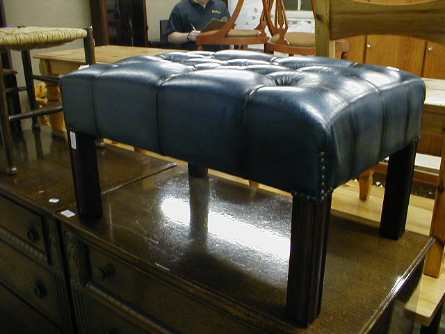 Appraisal: A blue leather upholstered modern stool