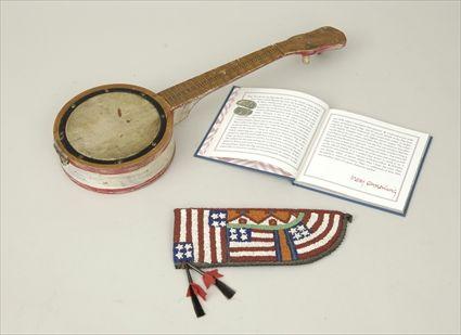 Appraisal: Banjo-Form Drum Together with an American flag book and a