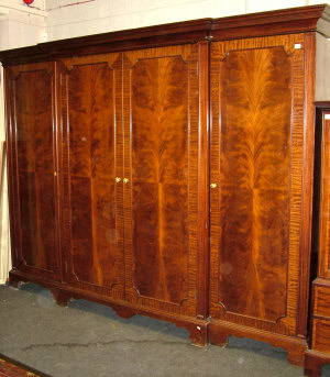 Appraisal: A breakfront mahogany wardrobe th century the moulded cornice above