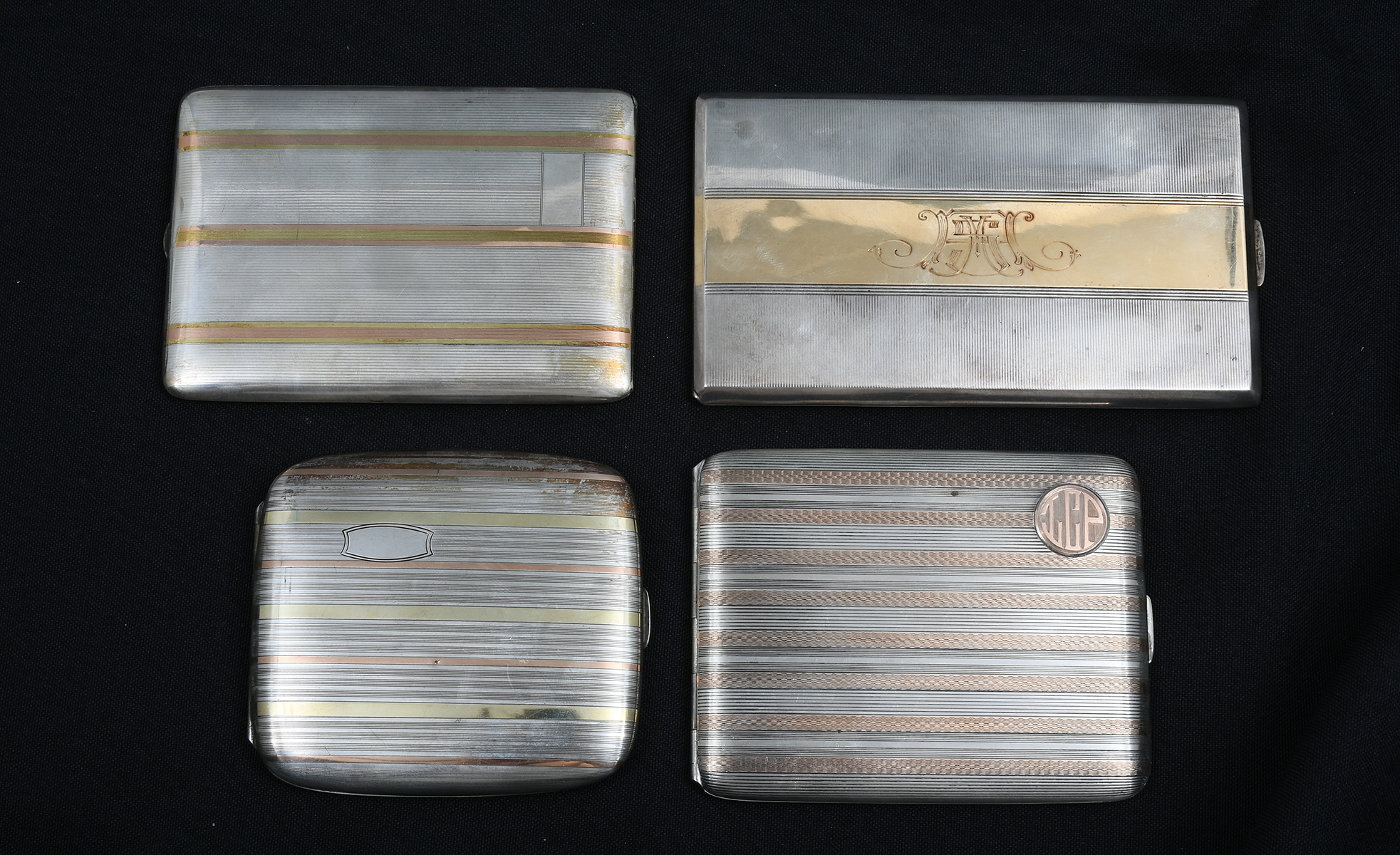 Appraisal: PC K GOLD INLAID SILVER CIGARETTE CASES Comprising - R